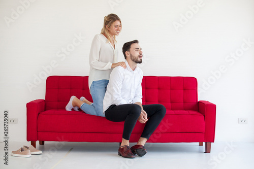 woman with a shoulder massage, use the hips on the sofa. Relaxing Concept