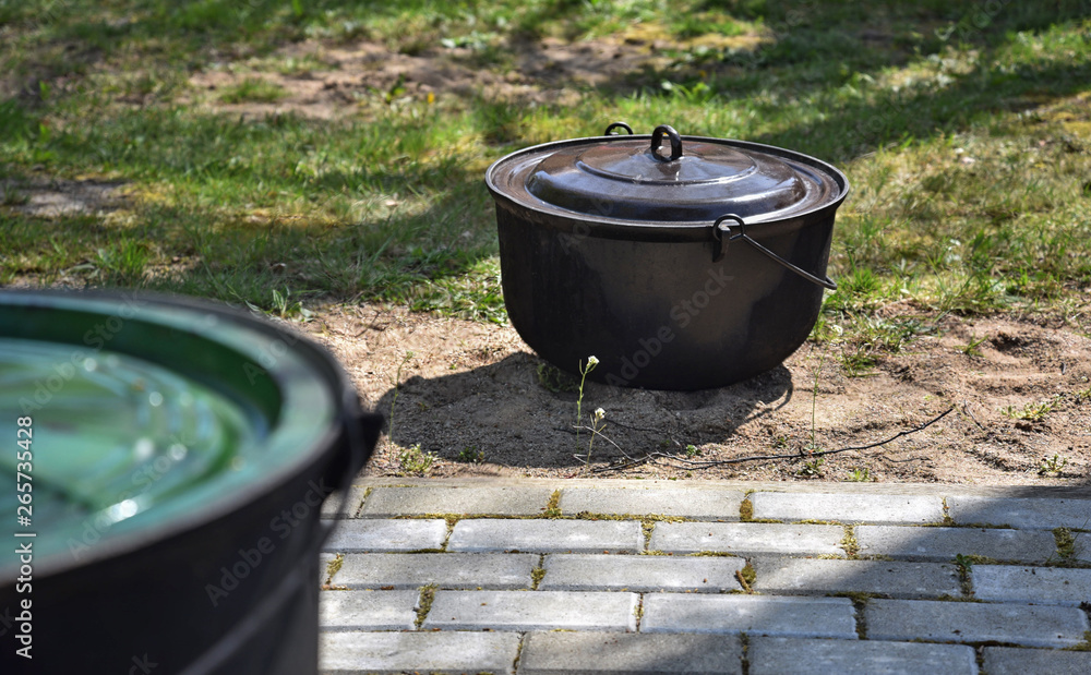  Making food in pots using firewood.