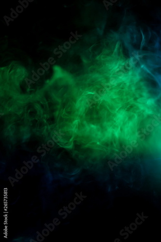 green smoke texture in dark black room .