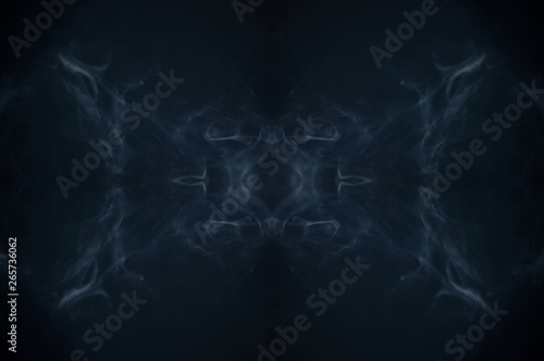 symmetry smoke texture background . screening flowing and glowing background .