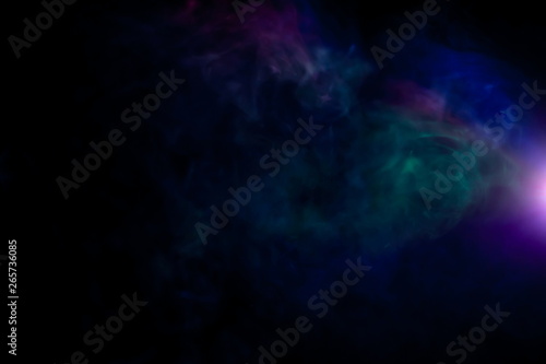 beautiful rainbow color projector with light beam for movie and cinema at night . smoke texture spotlight . screening for multimedia . black background .