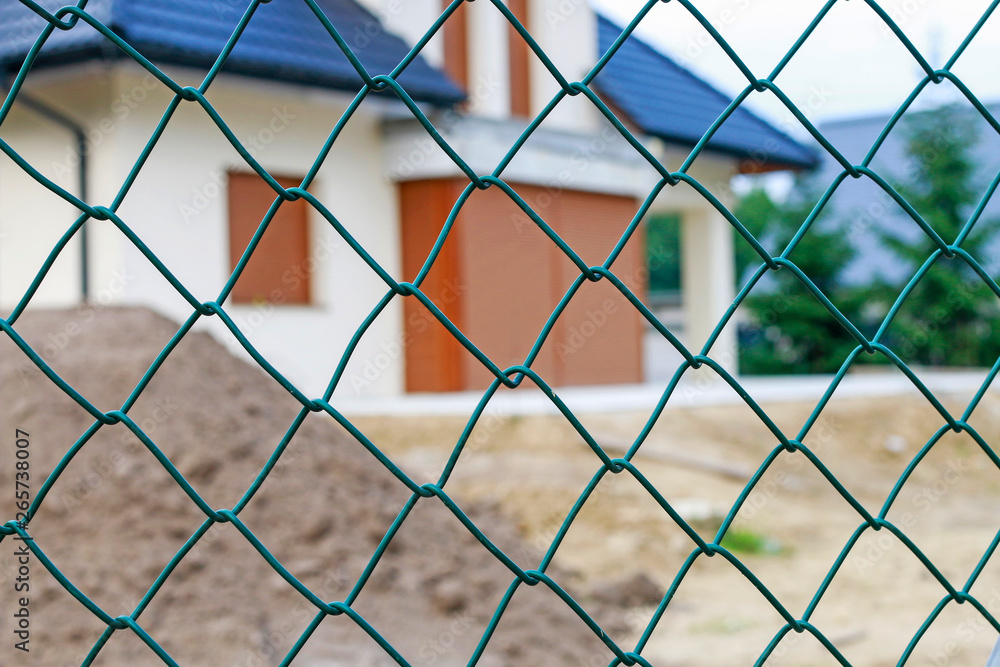 Fototapeta premium Fence mesh in front of the building.