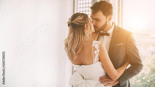 Young couples are kissing on the wedding day. The concept is happy in love.