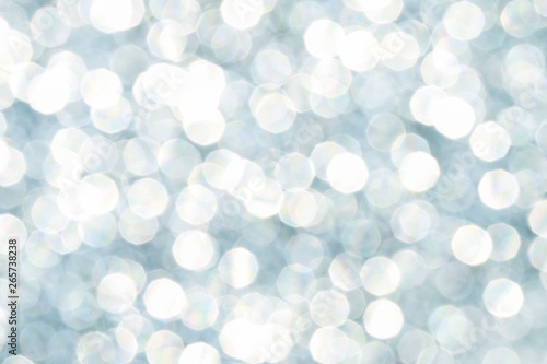 Blue glittering lights. Blurred abstract background.