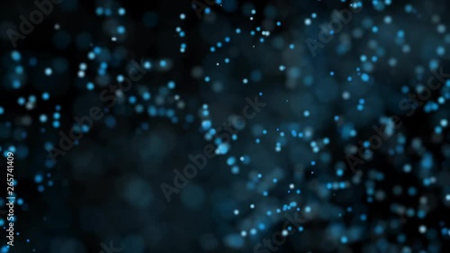 Abstract background with blue light glow particles bokeh on black background. Technology concept. 