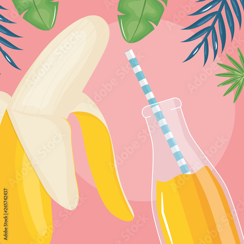 fresh banana slices juice fruit in botttle with straw in leafs palms