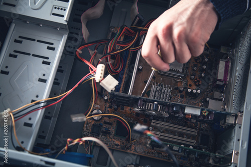 Technician repairing a computer.