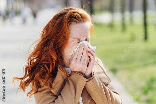 Young woman suffering from hay fever