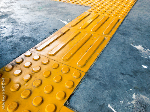 Yellow Dome and Block of Tactile Paving Which Act as A Guidance for Visually Impaired or Blind Citizen To Avoid Hazard on Street or Public Transport Such as Train Station or Subway Platform