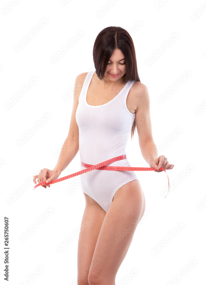 Happy pretty tanned woman with measure tape isolated on white background. Close up of sporty and beautiful female body. Healthy lifestyle, dieting, fitness, weight loss concept Happy pretty tanned woman with measure tape isolated on white background. Close up of sporty and beautiful female body. Healthy lifestyle, dieting, fitness, weight loss concept