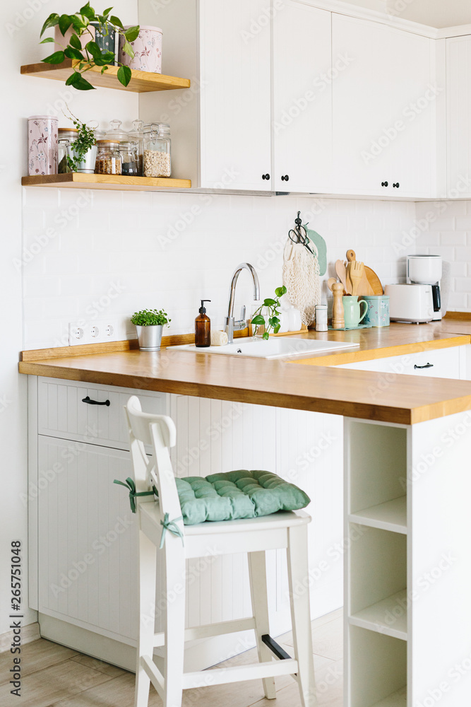 Fototapeta premium View on white kitchen in scandinavian style