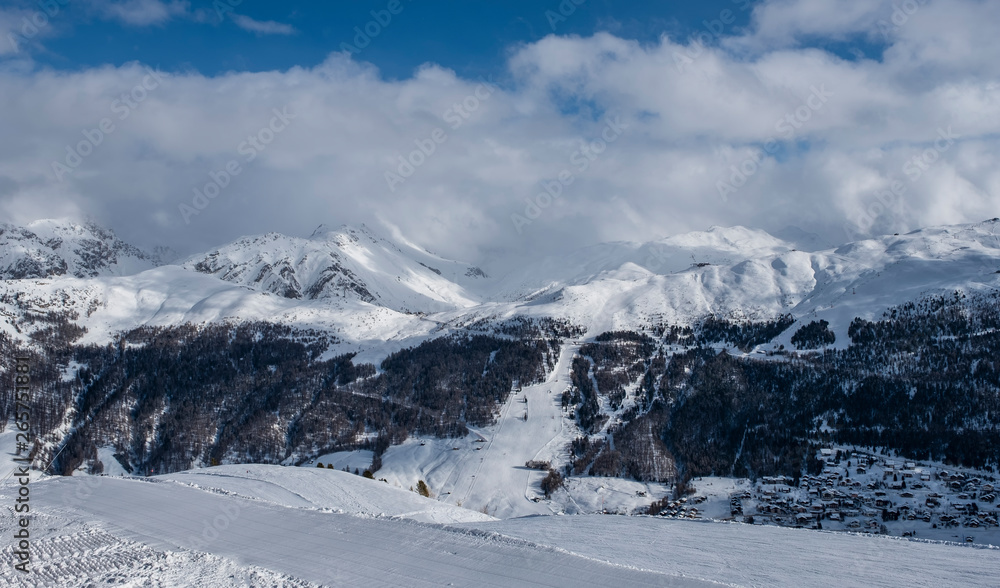 Alpine Ski Resort And Ski Slopes in Winter, Livigno, Italy Alpine Ski Resort And Ski Slopes in Winter, Livigno, Italy
