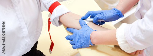 Preparation for blood test. Medical technician preparing before taking a blood sample from patient.