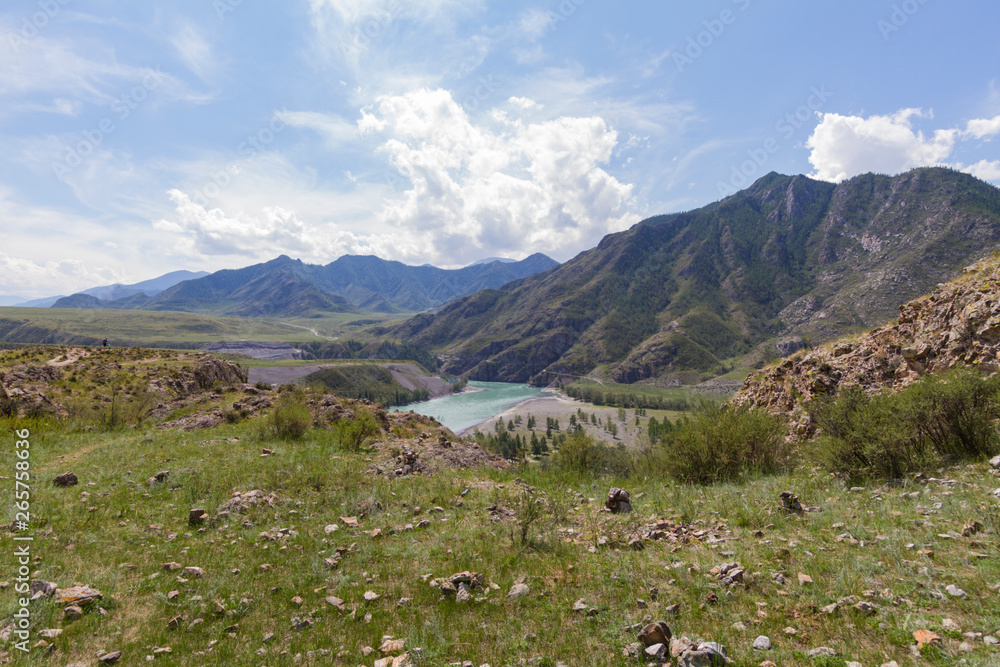 Panoramic view of an Altai mountain Katun river. Place of confluence of Katun and Chuya rivers. Summer time.