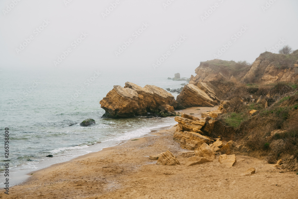 Beautiful wild Beach Fontanka near Odessa. Yellow and red sandstone cliffs are located on the seafront