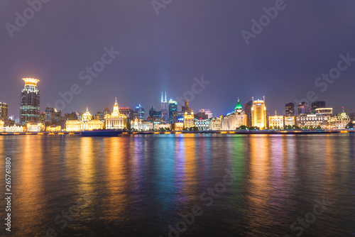The bund of Shanghai huangpu river of tall buildings in the evening. © 一飞 黄