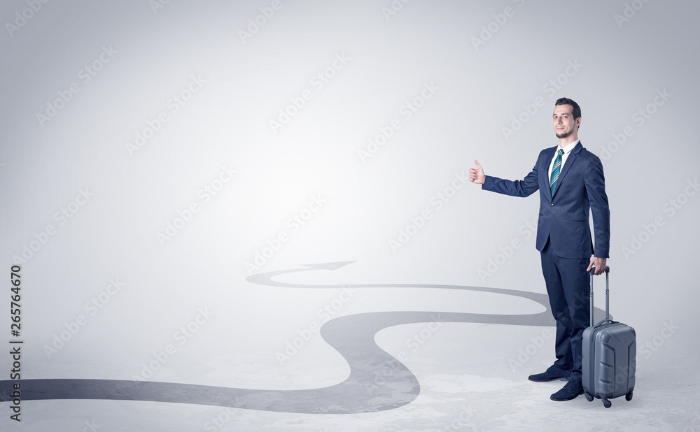 Young businessman hitchhiking with progressive arrow concept and copyspace
Young businessman hitchhiking with progressive arrow concept and copyspace