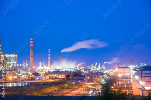 Oil refineries and oil depots and close-up of pipelines and destillation tanks of an oil-refinery plant in the evening © 一飞 黄