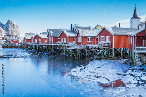 Beautiful contrasting red houses on the coast of the bay