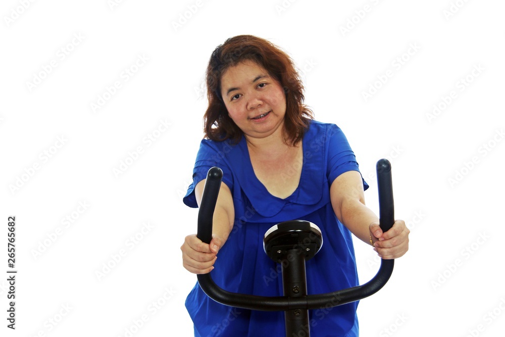 Fat women wear a blue shirt are exercising by cycling, isolated on white background. Fat women wear a blue shirt are exercising by cycling, isolated on white background.