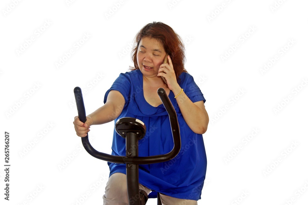 Fat women wear a blue shirt are exercising by cycling, isolated on white background. Fat women wear a blue shirt are exercising by cycling, isolated on white background.