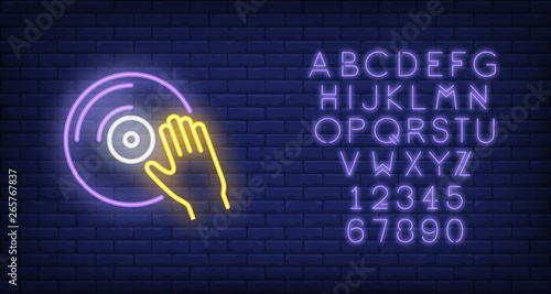 Vinyl disk with hand neon sign