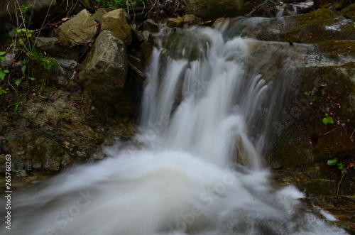 Fototapeta Naklejka Na Ścianę i Meble -  beautiful waterfall with clear water on a mountain stream in the forest