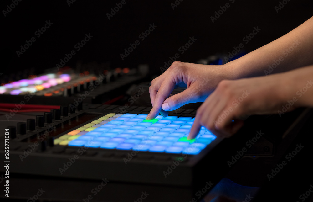 Fototapeta premium Dj hand remixing music on midi controller 