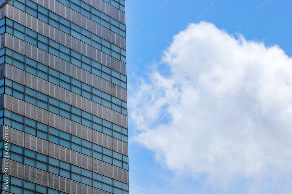 Window glass, Modern architecture in the blue sky white cloud city Window glass, Modern architecture in the blue sky white cloud city