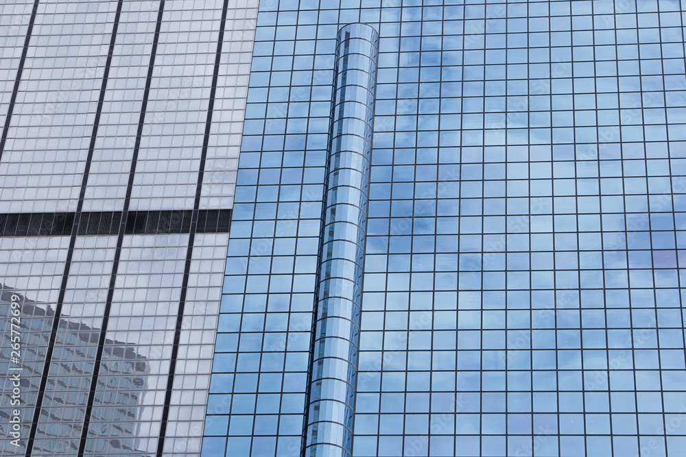 Window glass, Modern architecture in the blue sky white cloud city Window glass, Modern architecture in the blue sky white cloud city