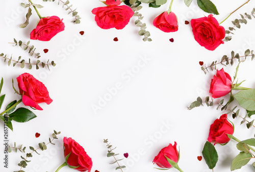 Festive red rose flower composition on the white background. Overhead view