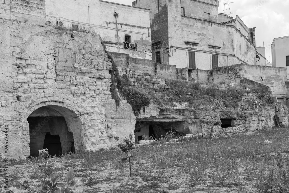 Massafra and its ravines. Houses built in the rock. Puglia in Black and White. Italy Massafra and its ravines. Houses built in the rock. Puglia in Black and White. Italy