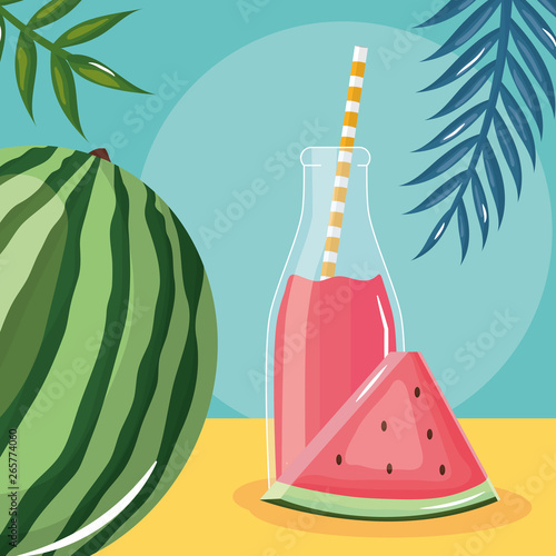 fresh watermelon juice fruit in botttle with straw in leafs palms