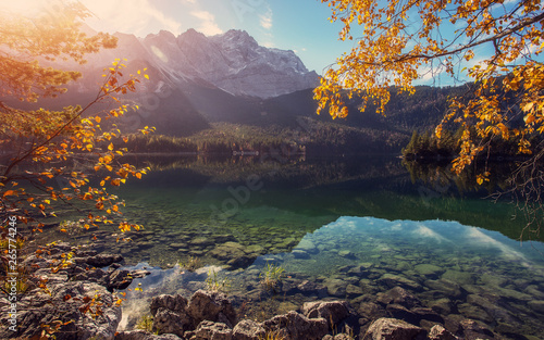 Impressive Autumn landscape The Eibsee Lake in front of the Zugspitze under sunlight. Amazing sunny day on the mountain lake. concept of an ideal resting place. Eibsee lake in Bavaria, Germany photo