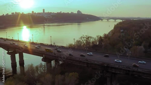 Aerial view of the Bridge across the wide Dnieper river in Kiev before sunset in spring photo