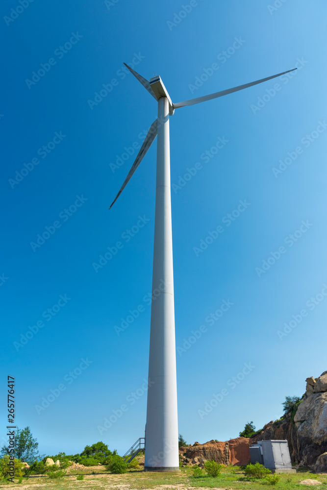 Wind turbines in the mountains near the sea Wind turbines in the mountains near the sea