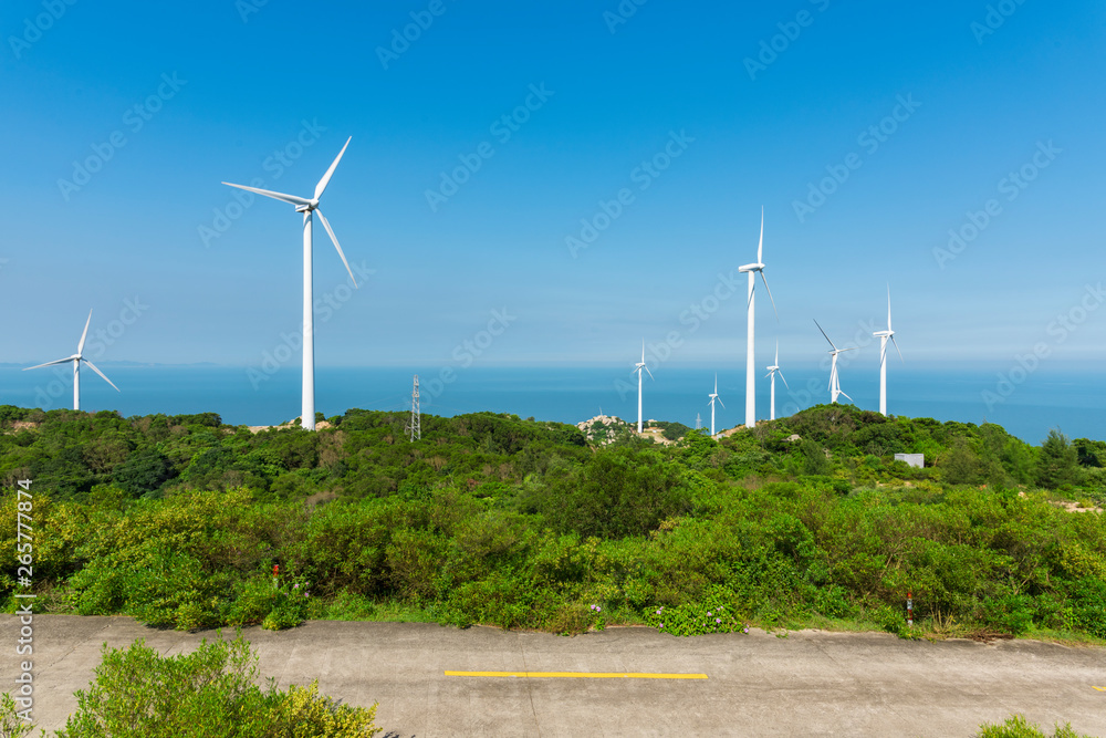 Wind turbines in the mountains near the sea