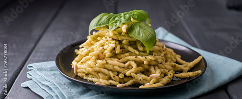 Traditional pasta trofie south of Italy with pesto and basil. Homemade meal for lunch. Copy space.