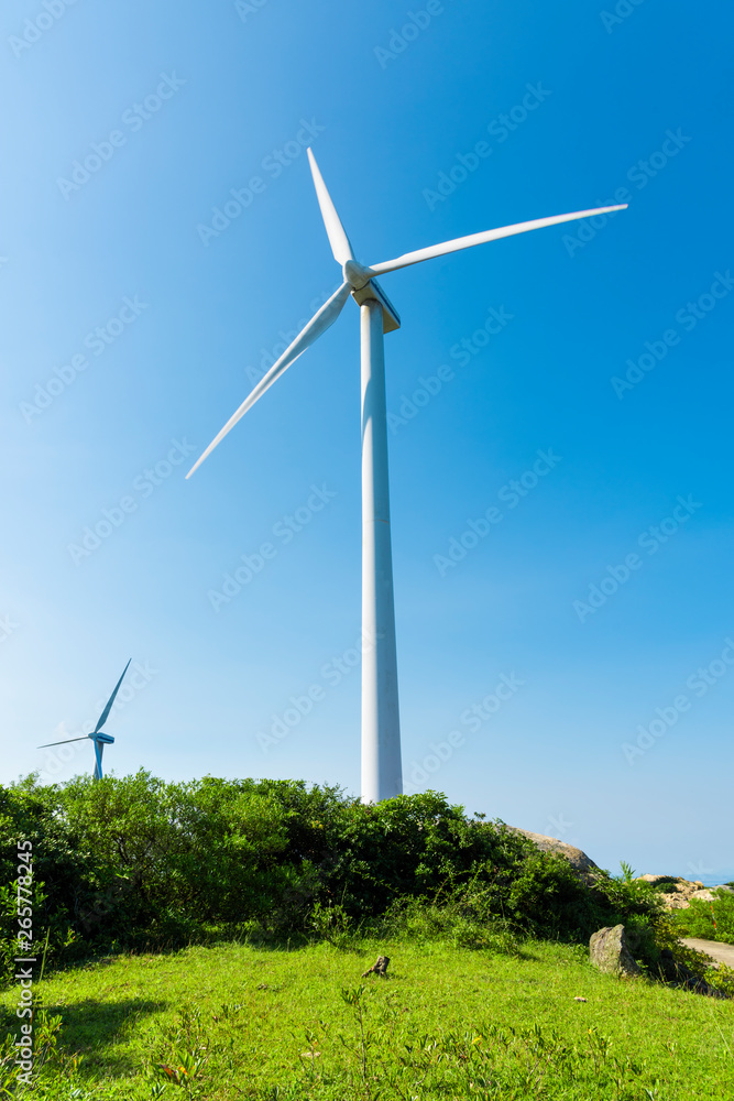 Wind turbines in the mountains near the sea Wind turbines in the mountains near the sea