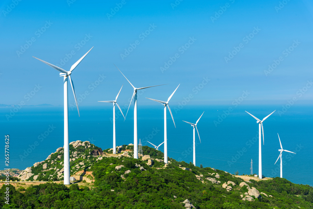Wind turbines in the mountains near the sea