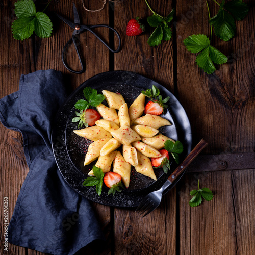 Kopytka - polish potato dumpling with strawberries photo