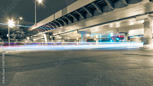The light path of a car under a highway and a viaduct. © 一飞 黄