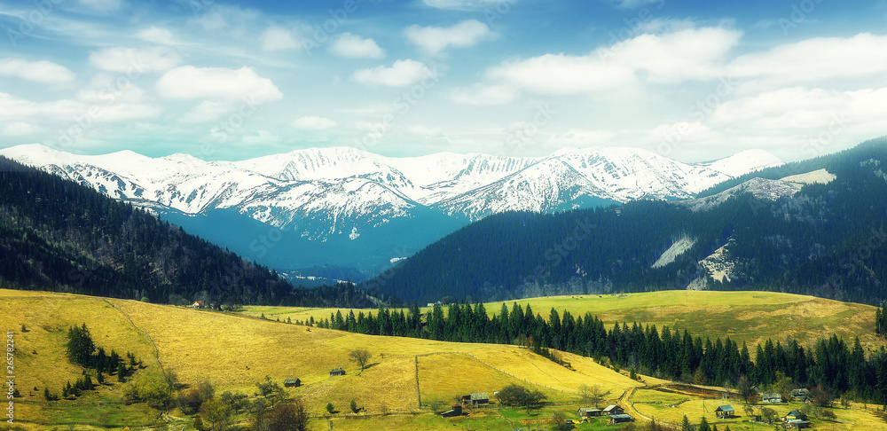 Awesome alpine highlands in sunny day. Spring Landscape inthe mountains with perfect sky. Wonderful nature background. Instagram filter.