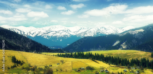 Awesome alpine highlands in sunny day. Spring Landscape inthe mountains with perfect sky. Wonderful nature background. Instagram filter.