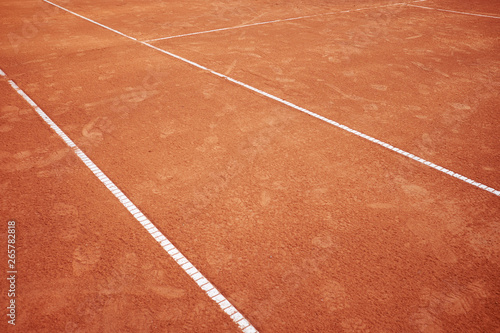 red sand tennis field with white lines background © Kiryl Lis