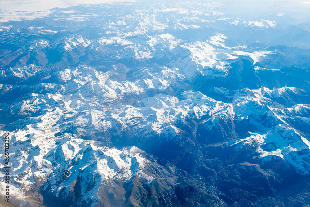 Airplane view of mountains covered with snow
