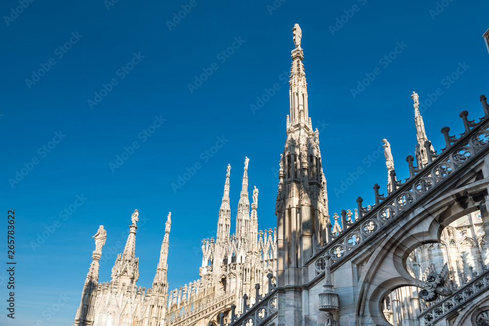 Marble statues - architecture on roof of Duomo cathedral
