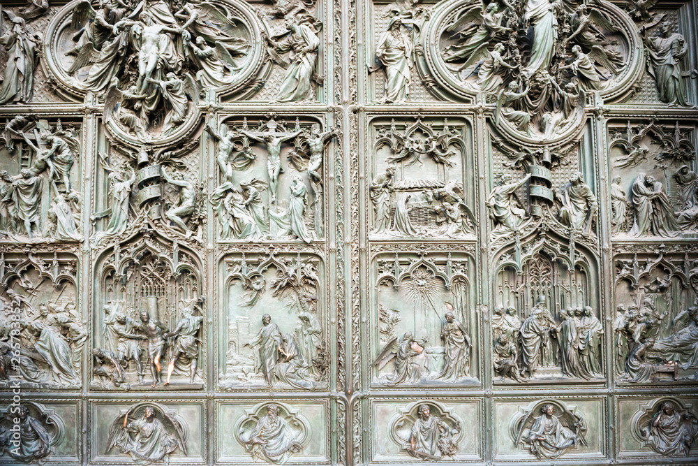 Doors with bas reliefs of cathedral Duomo di Milano Doors with bas reliefs of cathedral Duomo di Milano