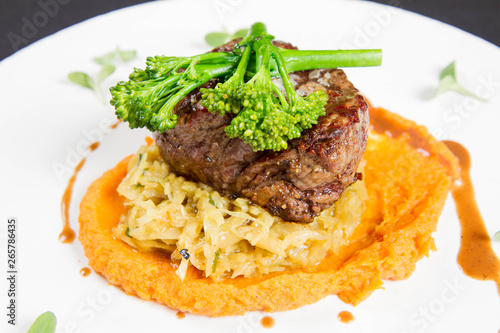 Beef sirloin with sweet potato mousse, curry sauerkraut and fresh thyme sauce
