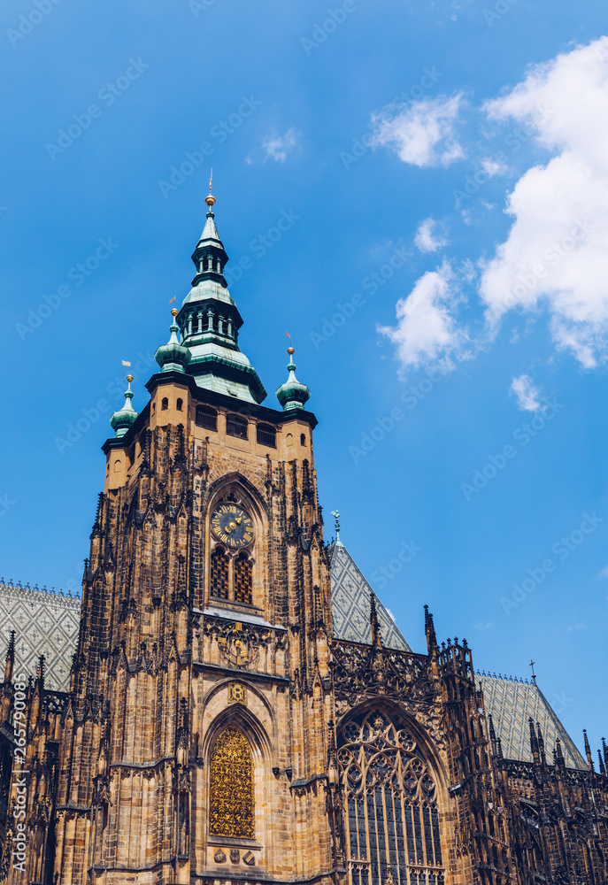Prague, bell gothic towers and St. Vitus Cathedral. St. Vitus is a Roman Catholic cathedral in Prague, Czech Republic. Panoramic view from the courtyard to the south facade. Prague, Czechia.